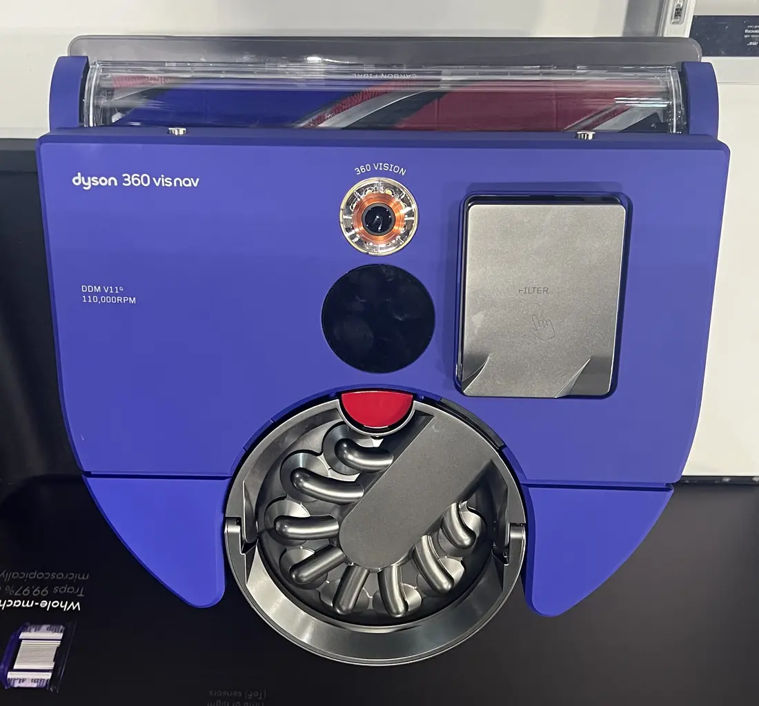 Blue Dyson robot vacuum seen from above, showing its 360-degree navigation camera